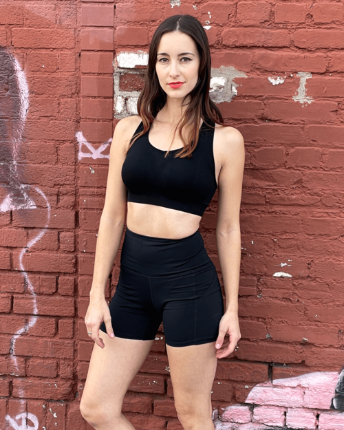 Victory Elite Jolie high-waisted athletic shorts with hip pockets, shown in black fabric and comfortable fit.