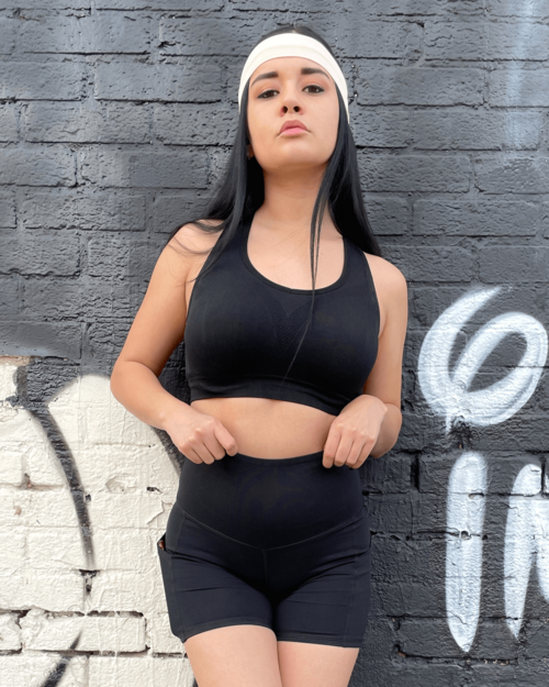 Victory Elite Jolie high-waisted athletic shorts with hip pockets, shown in black with a fitted waistband and side pocket details.