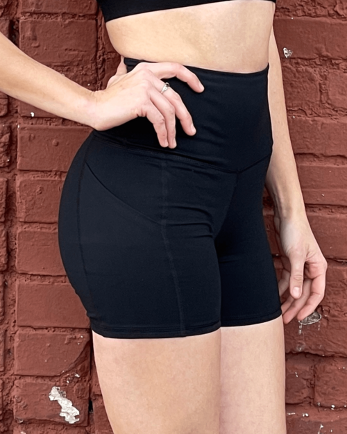 Victory Elite Jolie high-waisted athletic shorts with hip pockets, shown in black, featuring a snug fit and comfortable waistband.