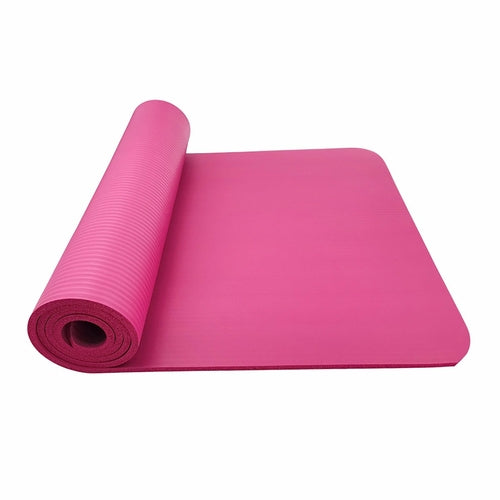 Victory Elite large slip yoga fitness mat laid out on a wooden floor, showing its textured surface and ample size for yoga workouts.